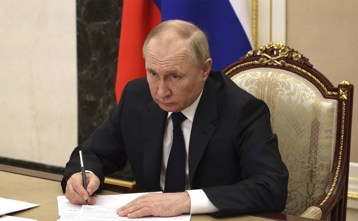 Elonas Muskas (kairėje) ir Vladimiras Putinas