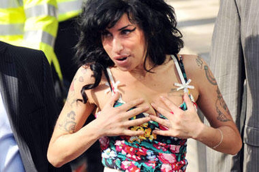 Amy Winehouse: paparacų nuotraukos privertė ją atsitokėti