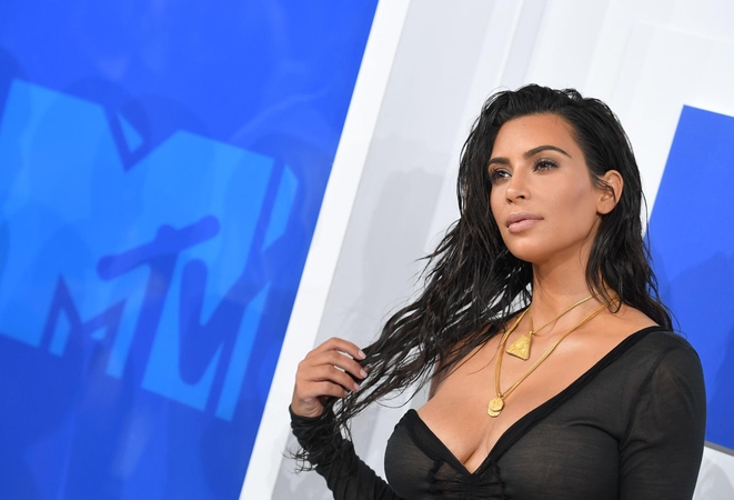 Apiplėšta K. Kardashian bylinėsis su portalu, kaltinusiu ją sukčiavimu