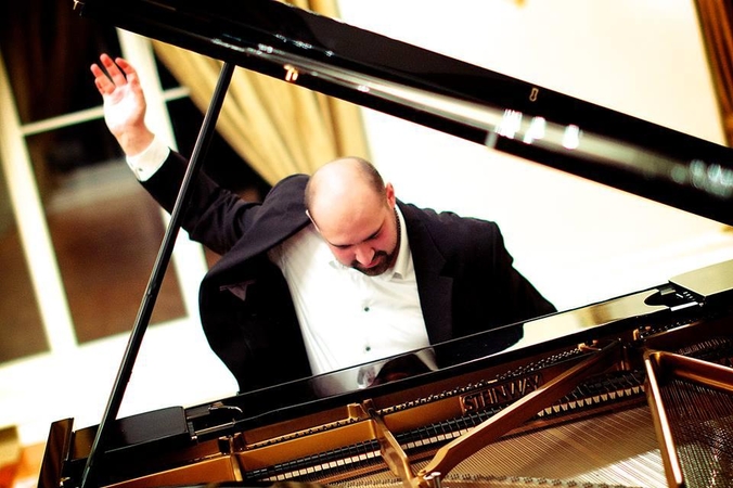 J.Šervenikas.
