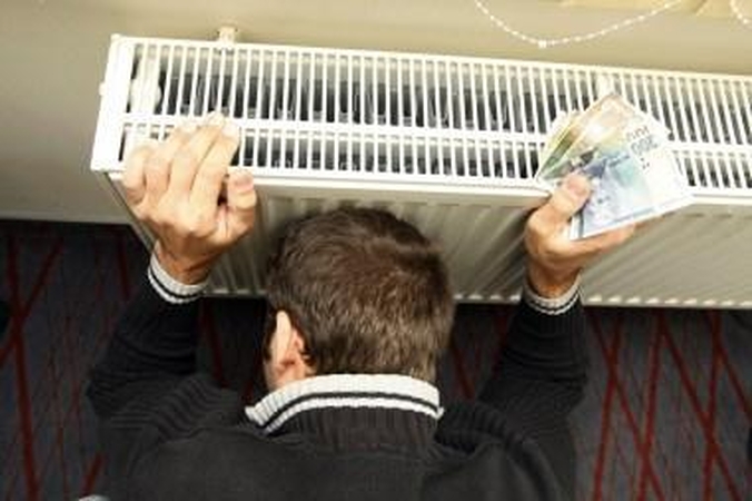 Jungas: žvėriškų mokesčių norintys išvengti ir nuo centrinio šildymo sistemos atsijungę žmonės vis tiek neišvengia mokesčių naštos.